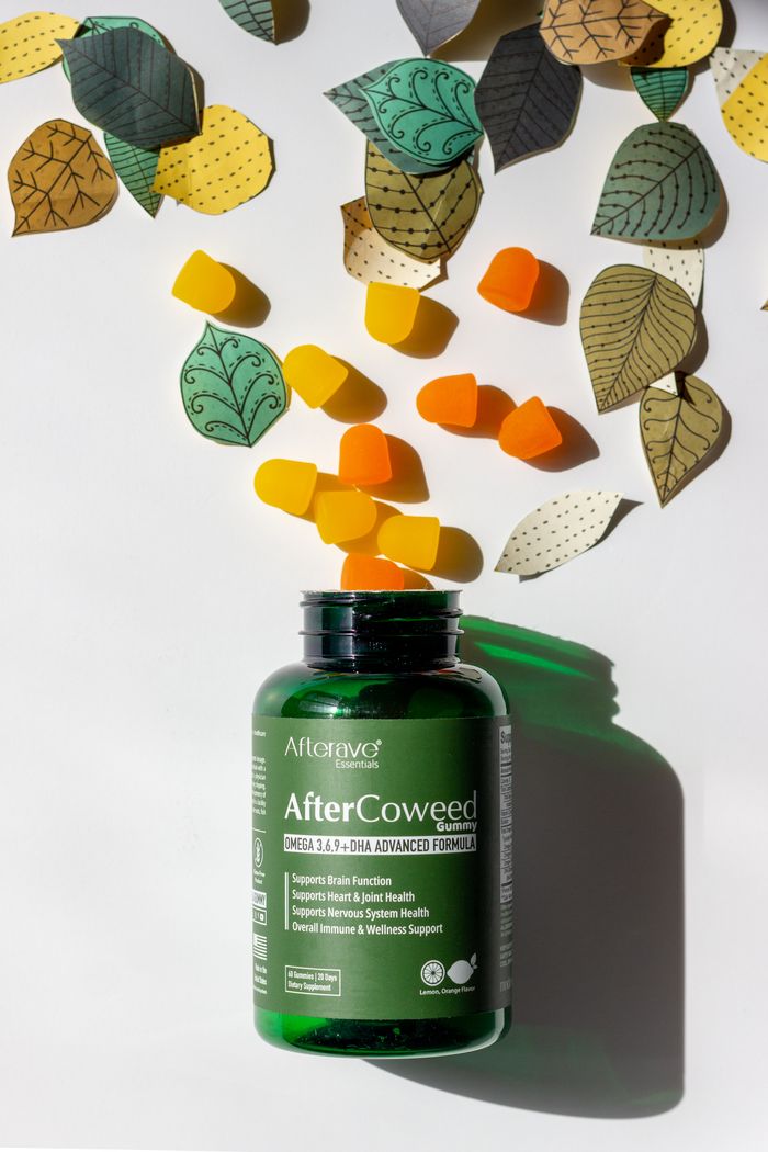 AfterCoWeed supplement bottle with colorful gummies and leaf illustrations.